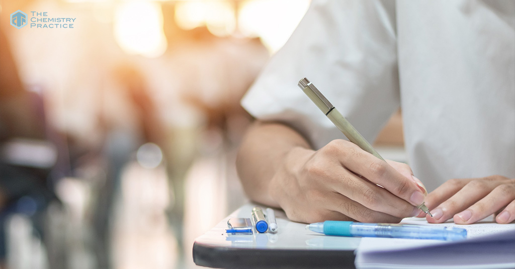 Student Hand with Pen Fill in Exam Test