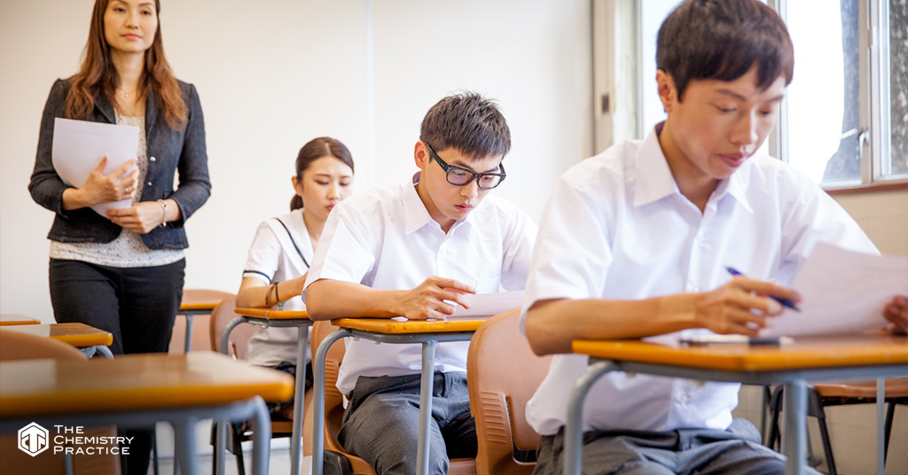 Teacher Supervising the Class During a School Exam